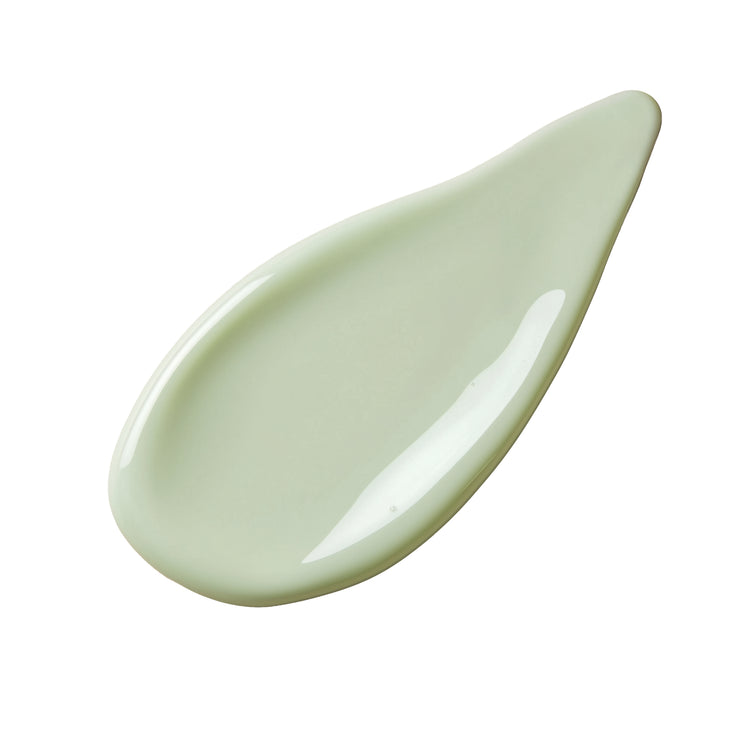 Light green ceramic spoon rest on a white background